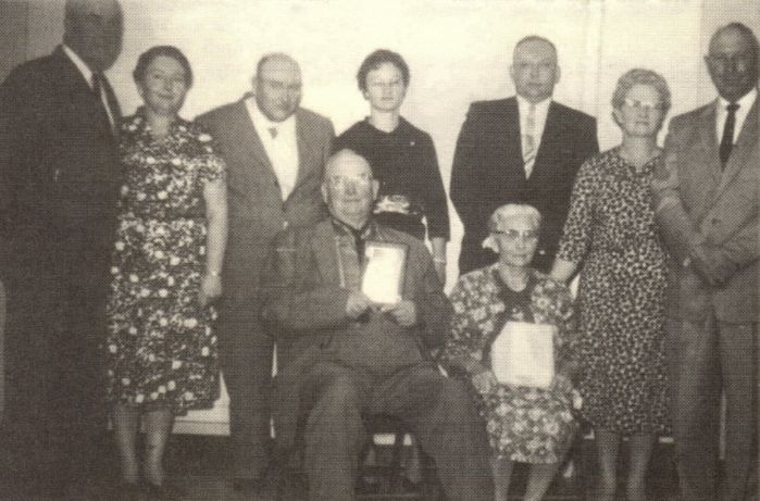 C.N. Boyer Family 1963. Phlete Warden, Ona, Otto, Helen, Ivan, Erma, Lee, C.N., Cora receiving the Good Neighbor Award